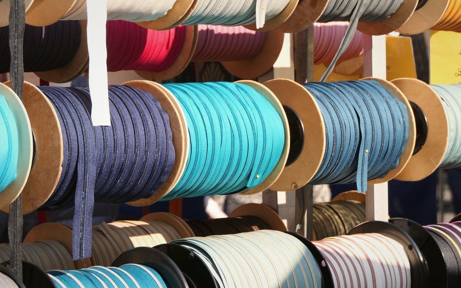 Spools of ribbon on their sides, shallow depth